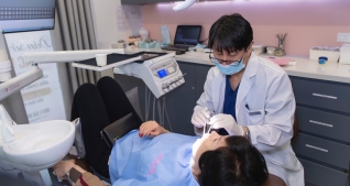 HN - Lấy cao răng đánh bóng và nhổ 01 răng khôn tại NK Singapore Aesthetics
